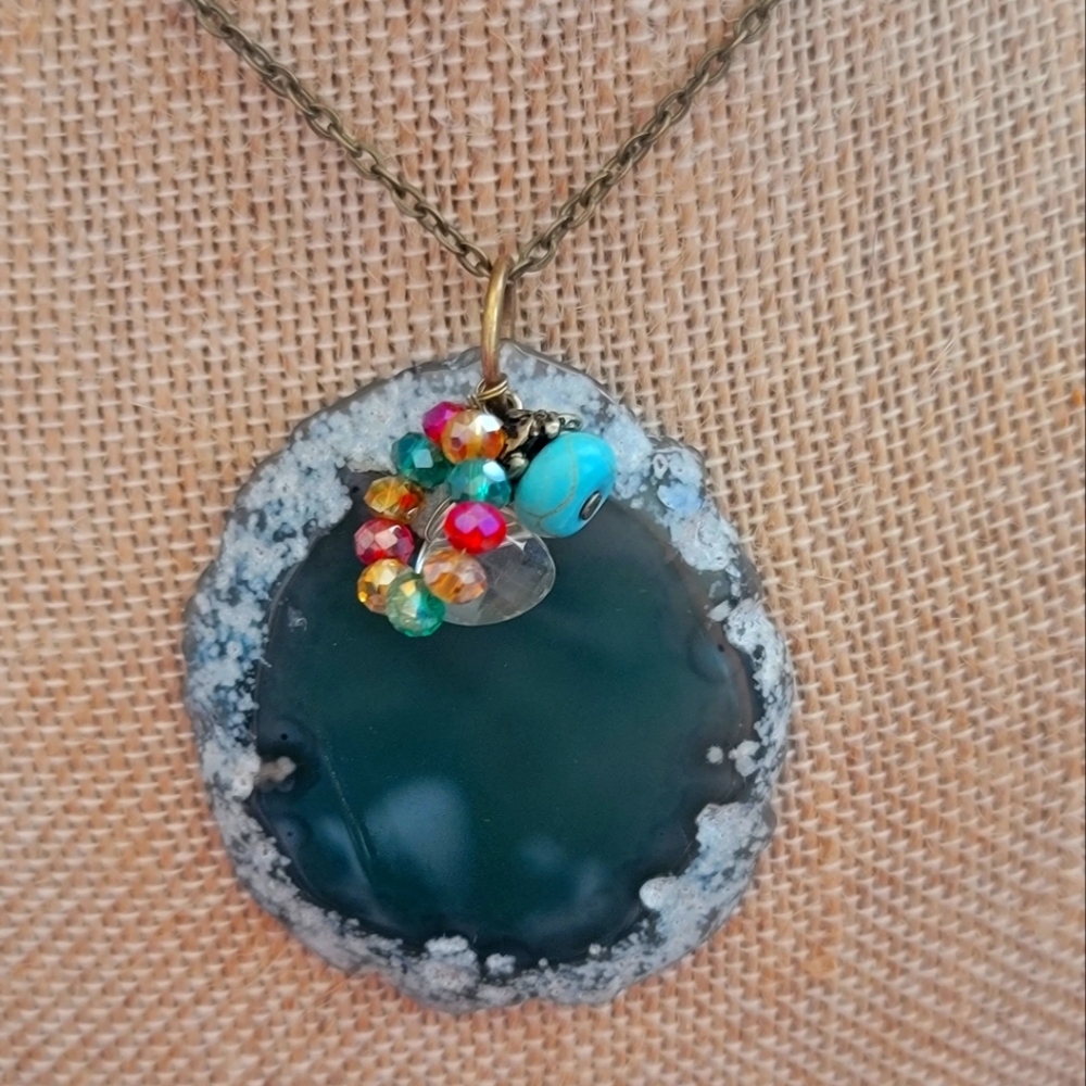 Bronze colored necklace w/sliced agate pendant. Green, turquoise